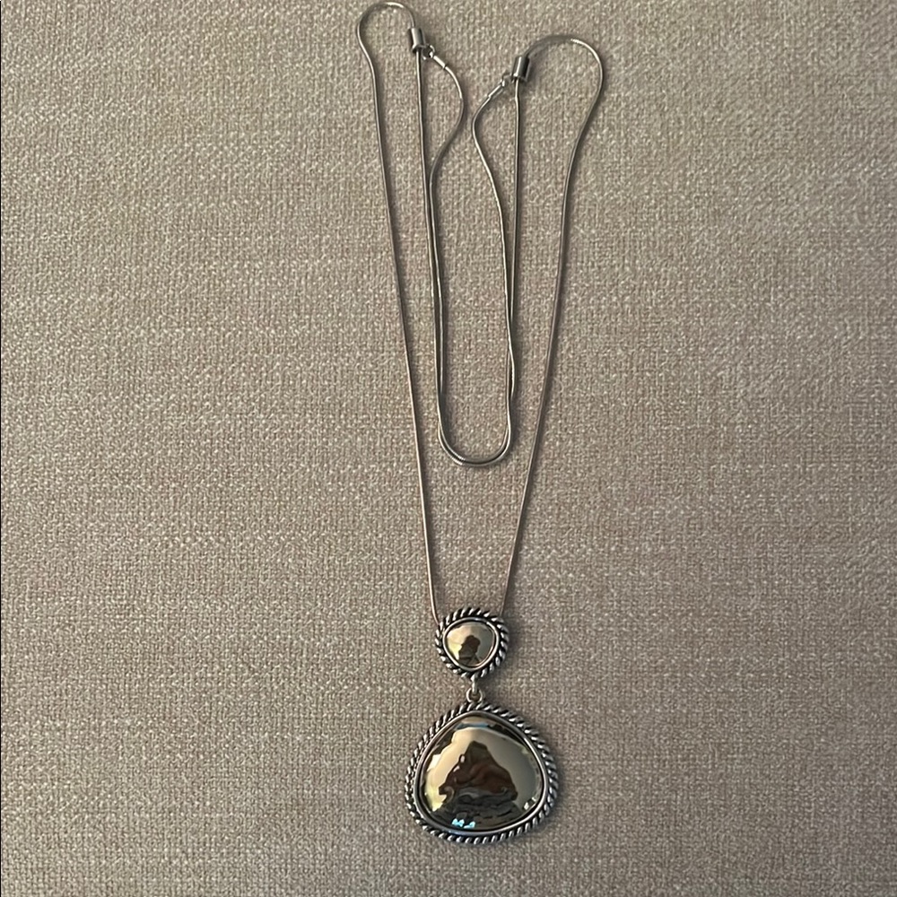 Long chain with Yurman style pendant.